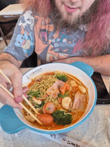 Customer eating Noodle bowl